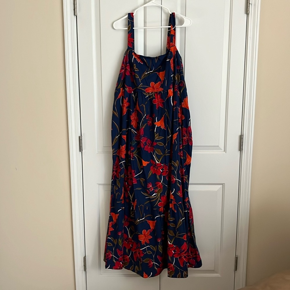 Navy maxi dress with red and orange floral detail.